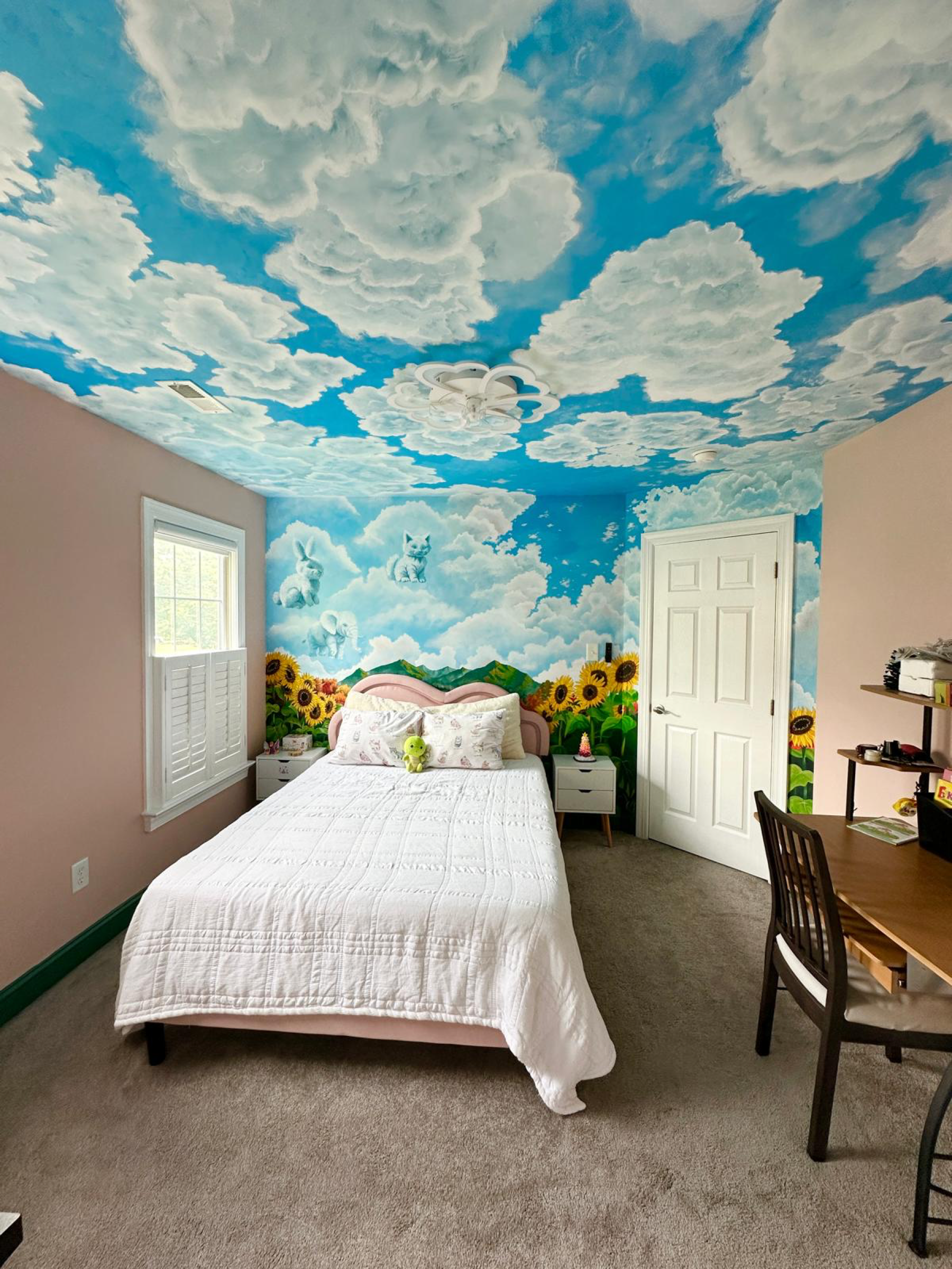Completed mural room with clouds on the ceiling and wall